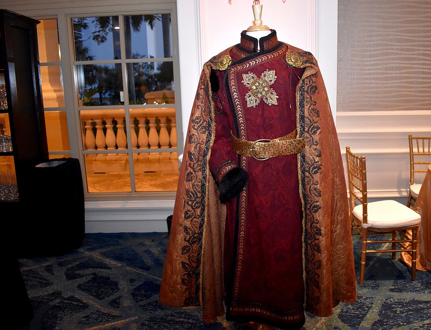 Patrons looked at various costumes used in the opera during cocktail hour.