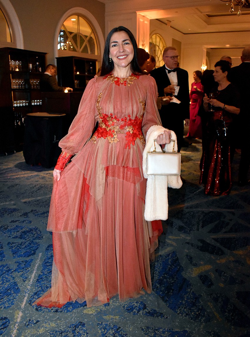Suellen Tillman rocks a Valentino dress.