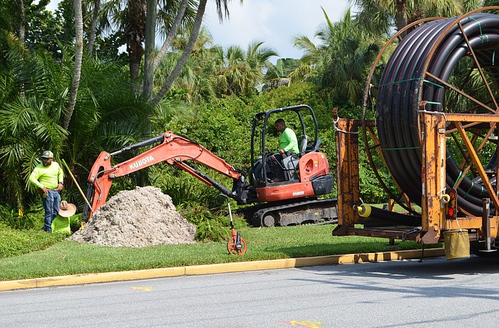 Town contractors are in the process of installing power and fiber cables.