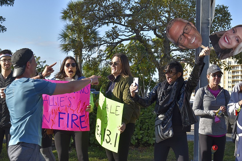 Andrea Chu, Madison Hufnus and Debbie Peilet cheer on Andy Peilet.