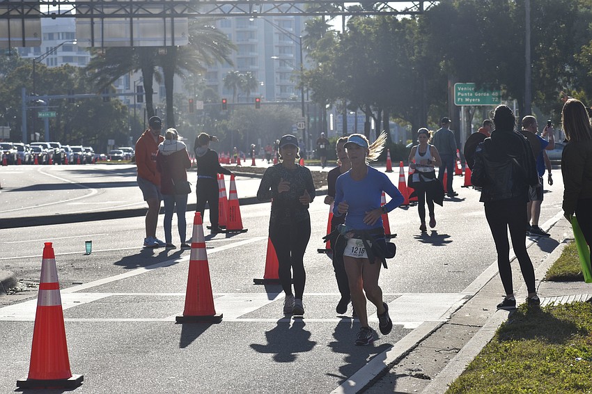 Runners make their way down Bayfront Drive.