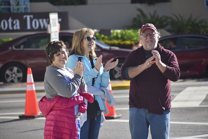 Nicole, Therese and Tim Dalrymple wait to cheer on their sister and daughter, Jessica.