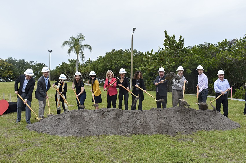 The Bay and the Barancik Foundation boards break ground on the new walkway.