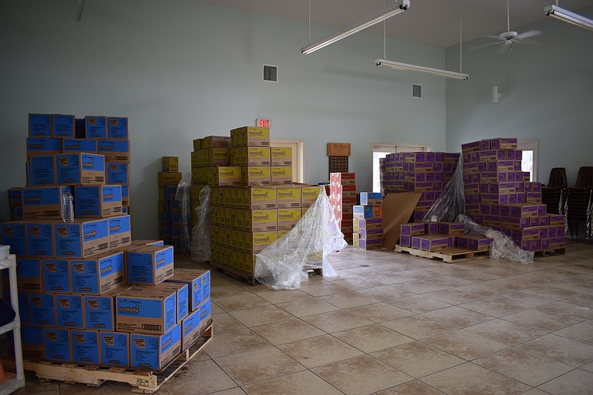 More than 57,000 cookie boxes will be organized into orders for Girl Scout troop leaders to pick up.