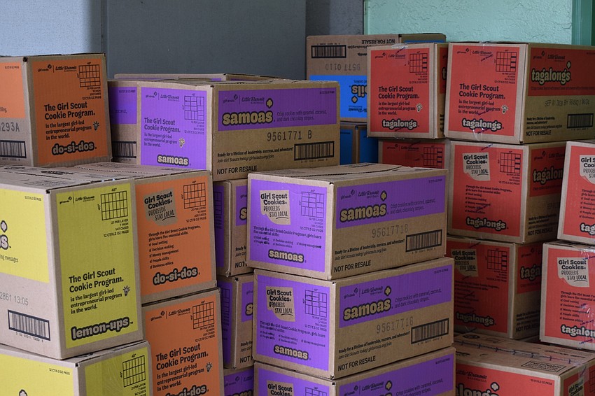 Girl Scout cookies are stacked and ready for troop leaders to pick up.