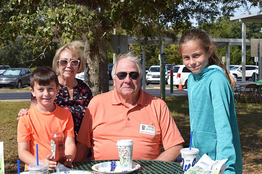 Liam Murray, a first grader, likes eating lunch with his grandparents Pat and Rick Jackle and his sister, Maeve Murray, a fifth grader at the school.