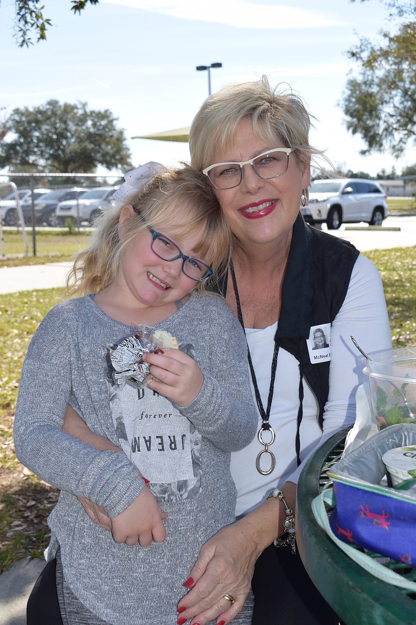 Leah Olsen, a first grader, and her grandmother Joyce Miller love spending time together, especially one-on-one at McNeal's Grandparents Day. Olsen talks to Miller about how her day at school is going and what she does in class.