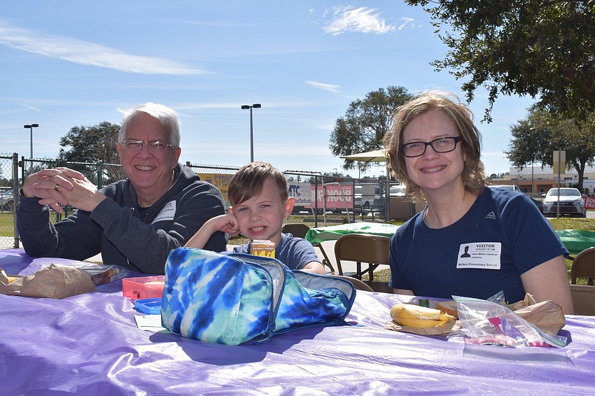 Bud Clarkson eats lunch with his grandson Jackson Miller, a first grader, and his wife Jeannie Clarkson. This year was the Clarksons' first Grandparents Day as they were visiting from Ohio.