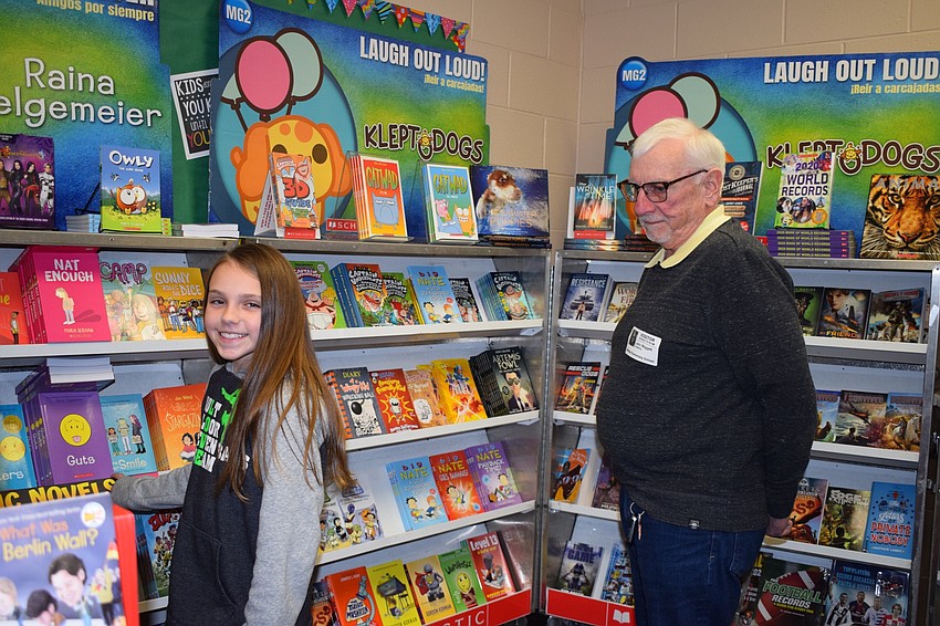 Luci Palmtag, a fifth grader, goes to the book fair with her grandfather John Waggett. Waggett says they come from a family of readers.