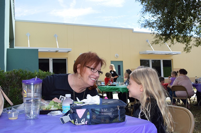 Trish Griffin laughs with her granddaughter Liliana Macri, a first grader, while having lunch.