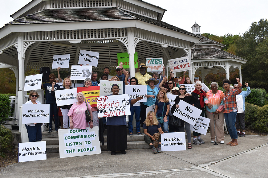 Residents protest the county&#39;s redistricting map at Phillippi Estate Park.