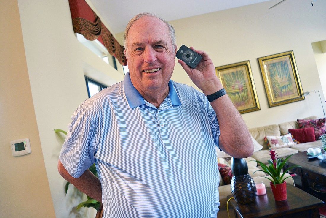 Country Club at Lakewood Ranch resident Richard Williams is an advocate for himself and others affected by hearing loss. He can use this remote control to change settings for the inner ear implant he got in 2011.