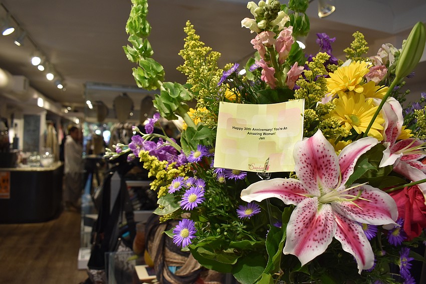 Congratulatory flowers decorated the store.