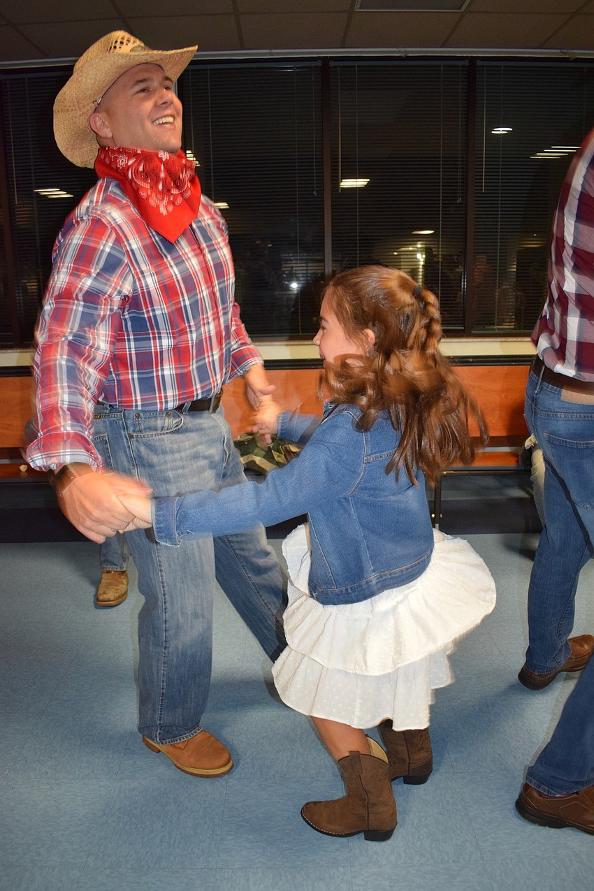 Kurt Bradshaw and his daughter McKinley, who is in second grade dance together. Kurt Bradshaw says he loves spending time with his daughter.
