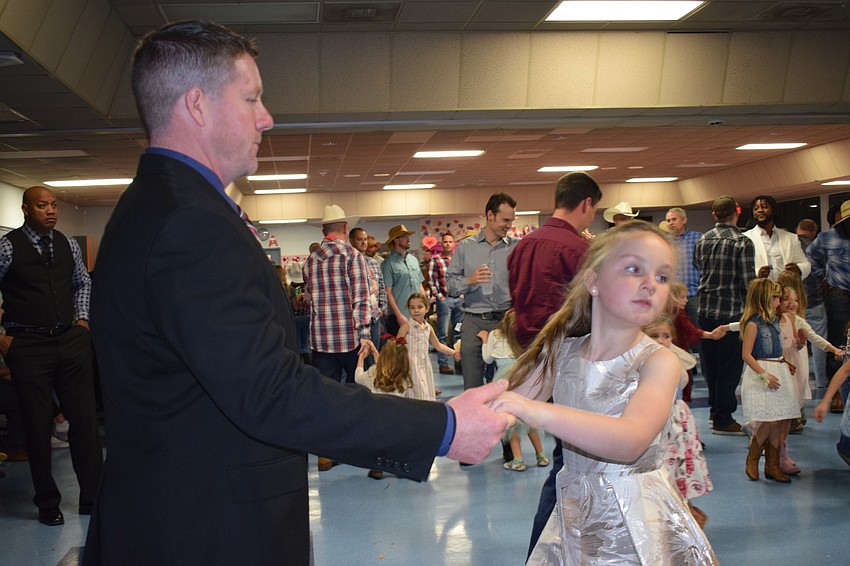 Pat Lavin has been going to the father-daughter dance with his daughter Abigail, who is in third grade, for years. Abigail Lavin says she loves the songs and dancing.