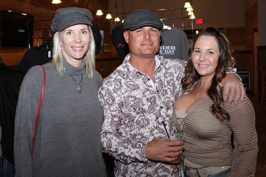 Cheryl Cochrane with Rick and Regina Taugner