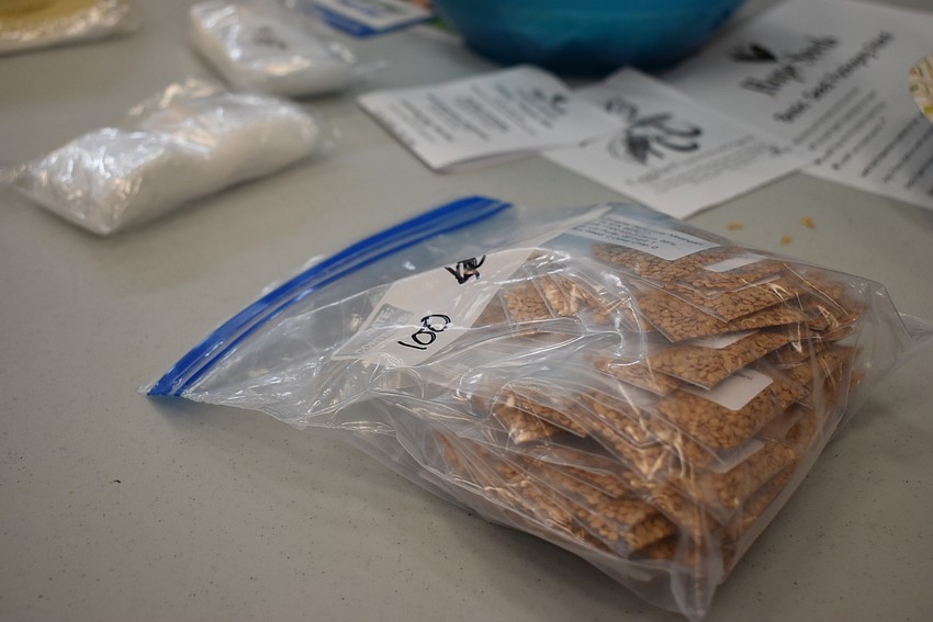 Once volunteers packed 100 seed bags, they organized them into bundles.