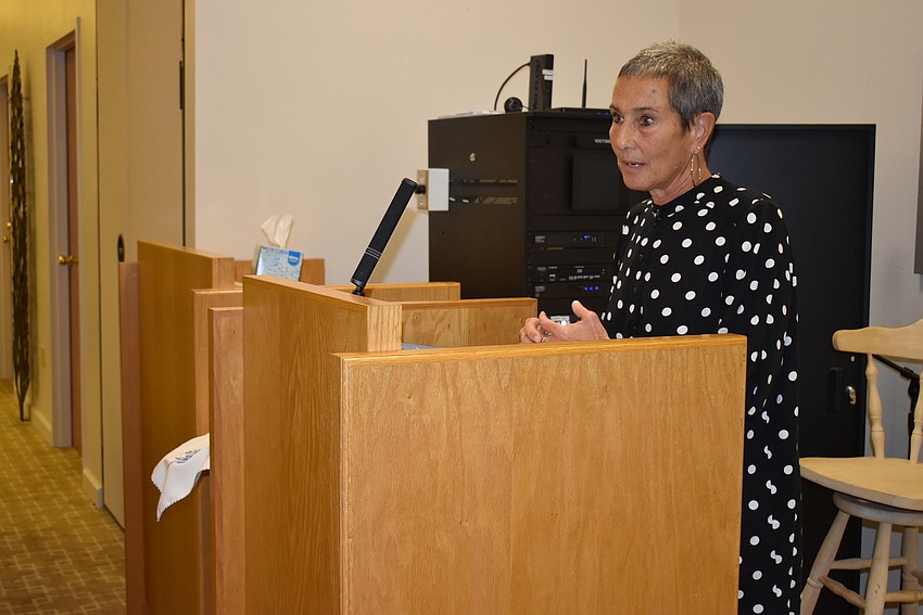 Nelle Miller addresses the gathered members.