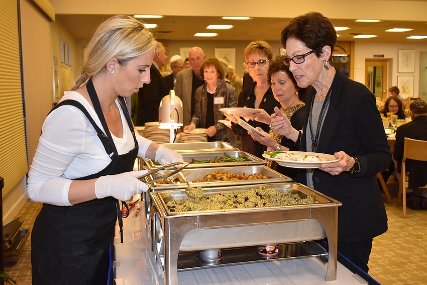 Members line up for dinner.