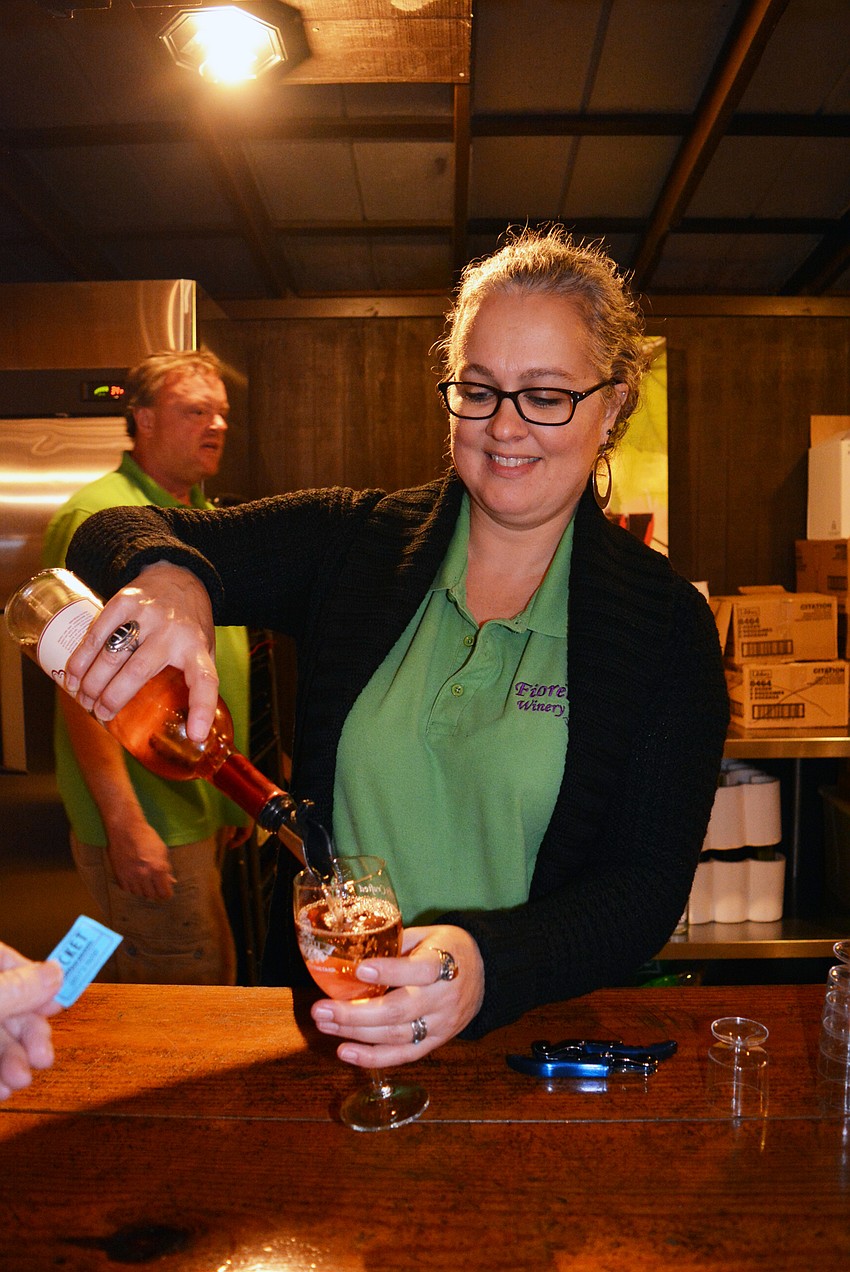 Cathy Snyder pours Rosa Fiorelli's wines to guests and is happy to answer questions.