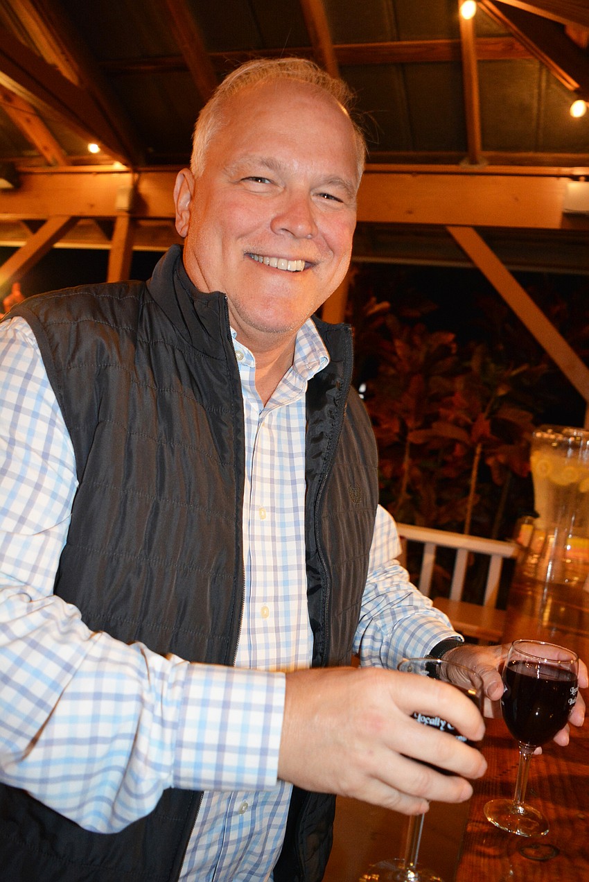 Lakewood Ranch's Joe Pritchard gets a glass of cabernet sauvignon each for himself and his wife, Pam Pritchard.