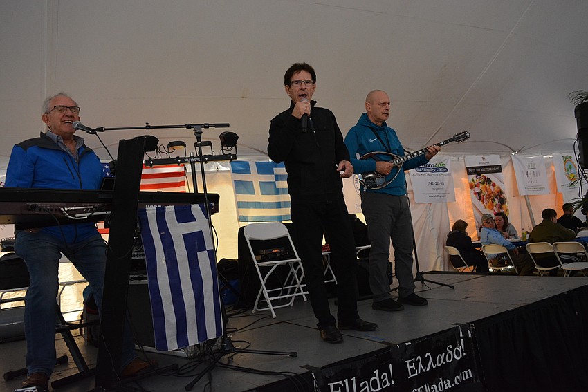 The Ellada! band, comprised of Dino  Theofilos, Elias Poulos and Leonidas Cafiris, keep the crowd entertained.
