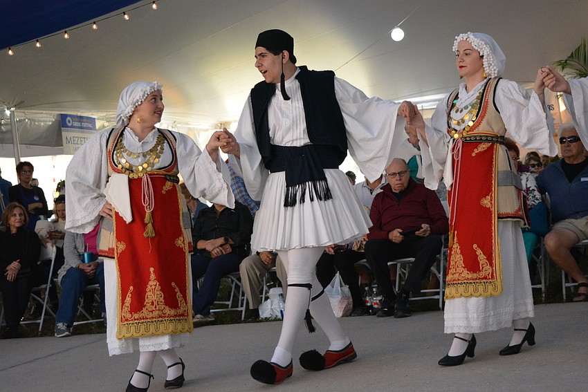 Jenna Choueiri, Vincent Alesi and Morgan Kirlangitis thrill the crowd with their Hellenic dance demonstration.