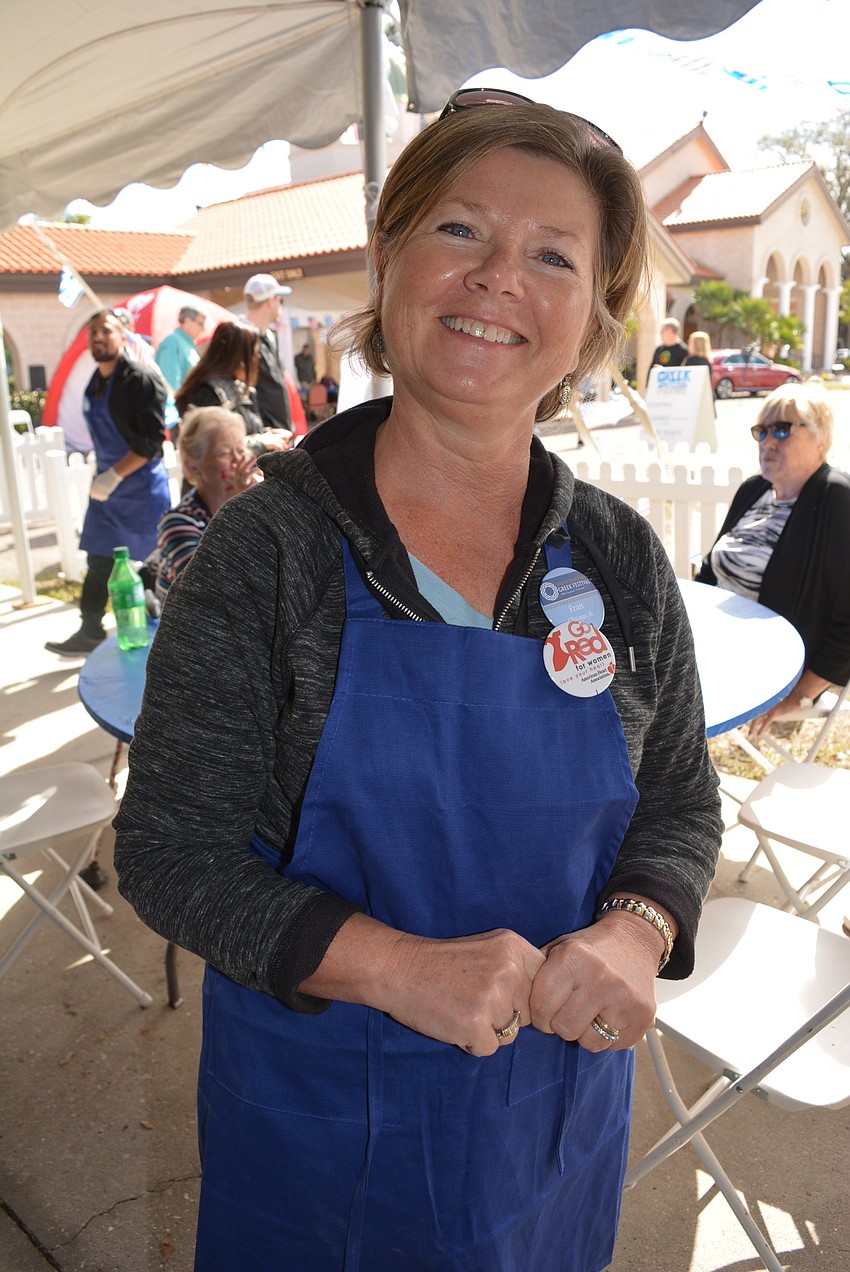 Bird Key's Fran Geary volunteered on the food line.