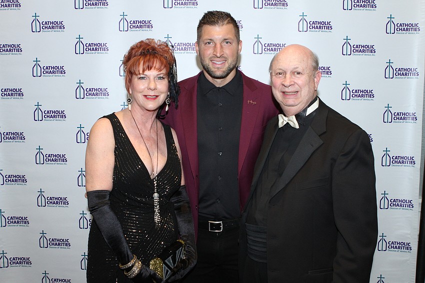 Co-chairwoman Marilee Roberts, Tim Tebow, Gary Roberts
