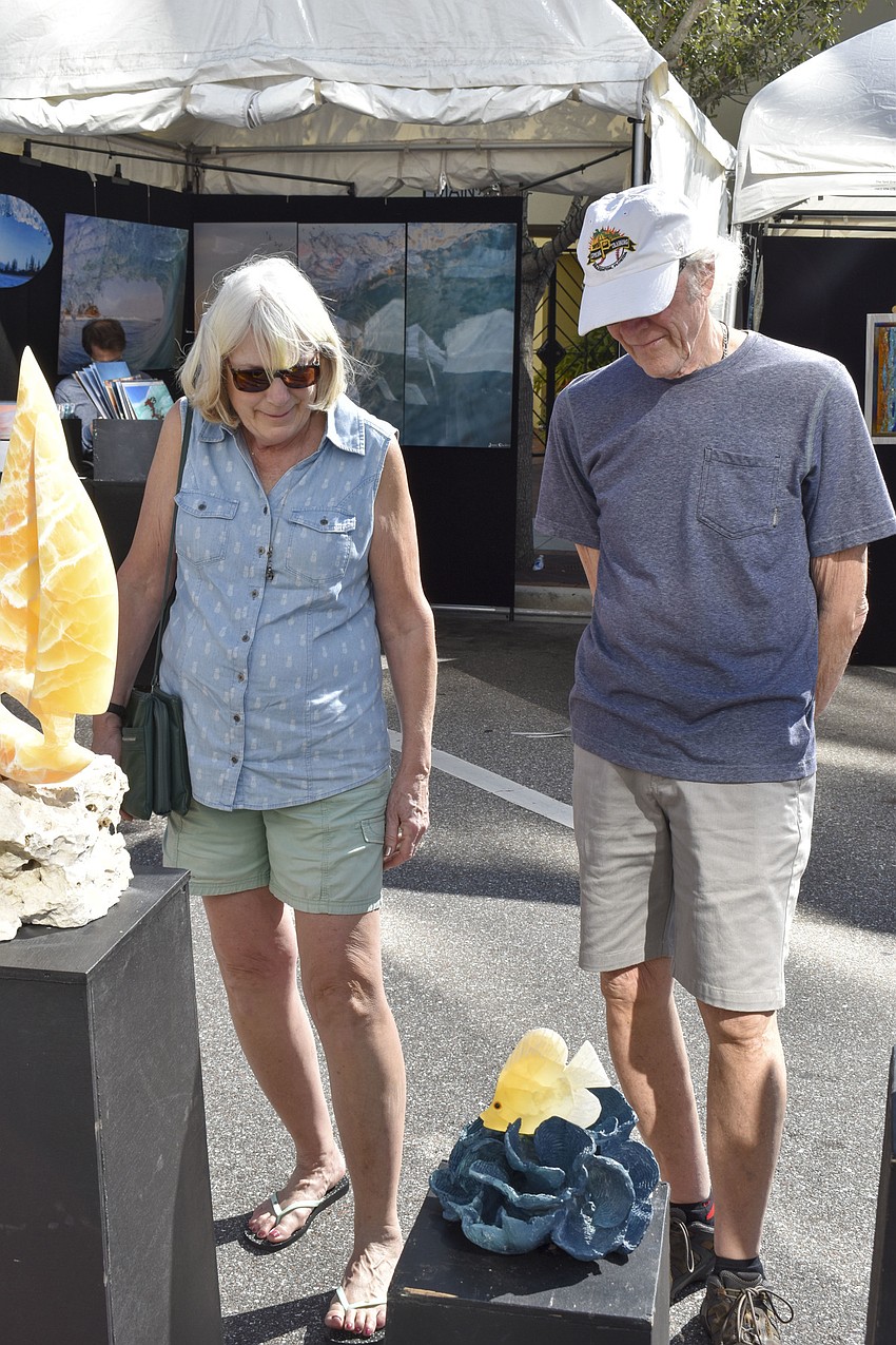 Donna and Jack Klump stop to look at a sculpture.