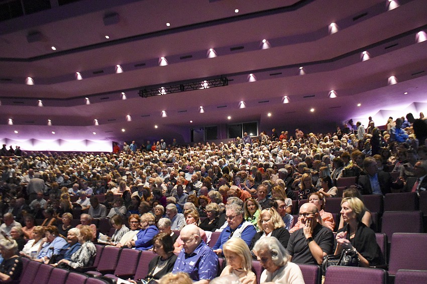 Guests wait for Rick Steves' talk to begin.