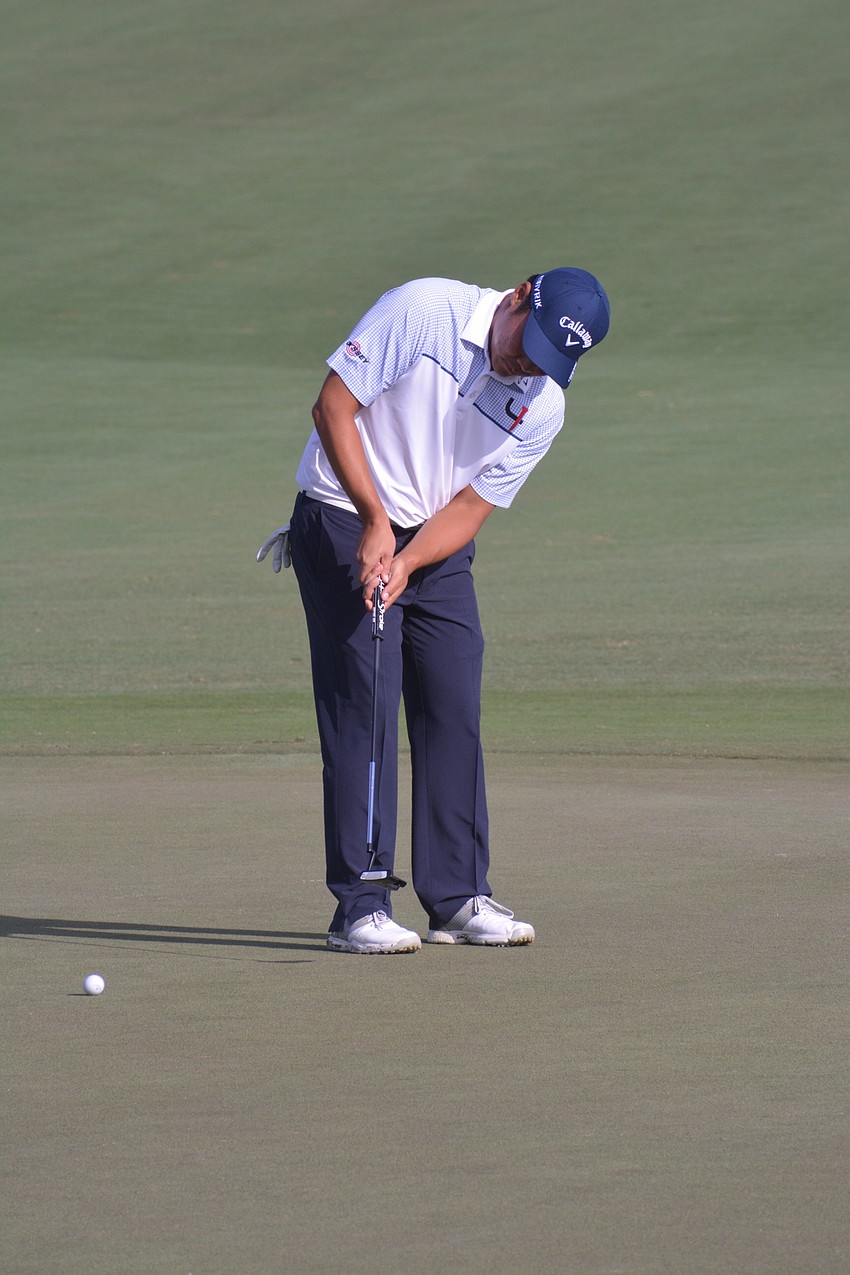 John Chin sinks a putt for bogey on the No. 18 hole at Lakewood National. Despite the bogey, Chin finished four under par on day one of the LECOM Suncoast Classic.