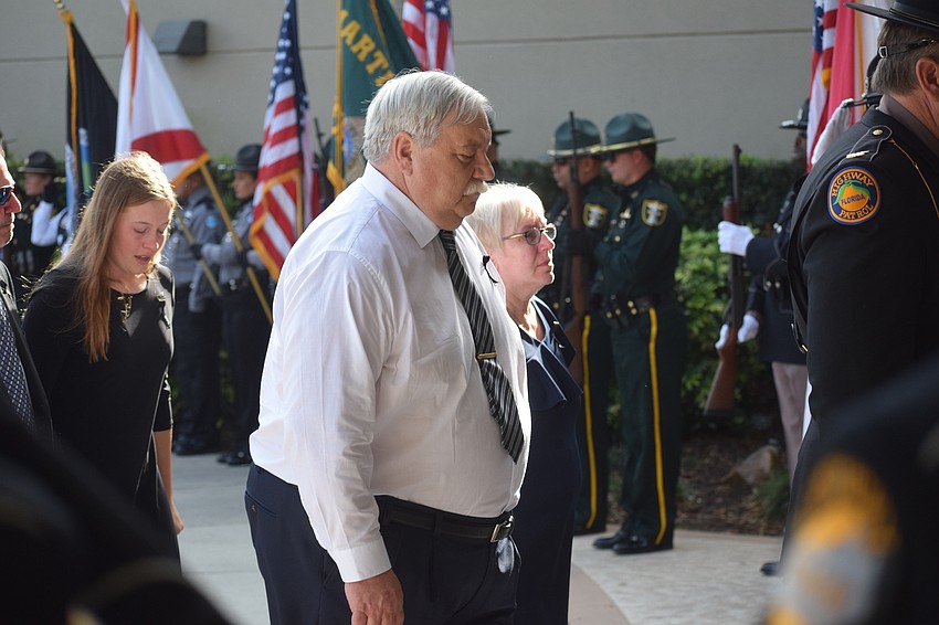 Trooper Joseph Bullock's parents, Jon and Val Bullock of Englewood, enter Bayside Community Church for the service.