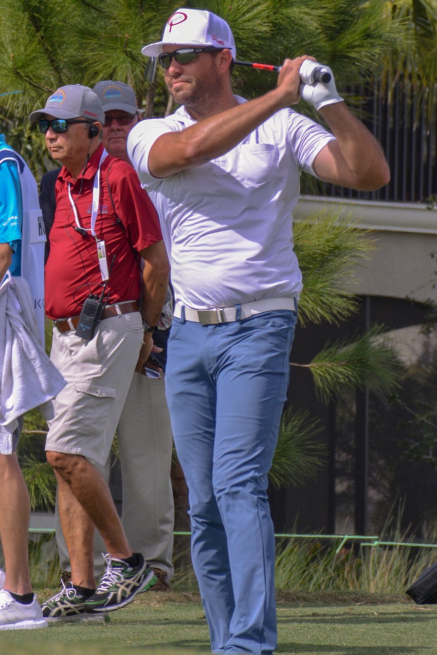 Seath Lauer, a member at Lakewood National, tees off from the No. 1 hole.