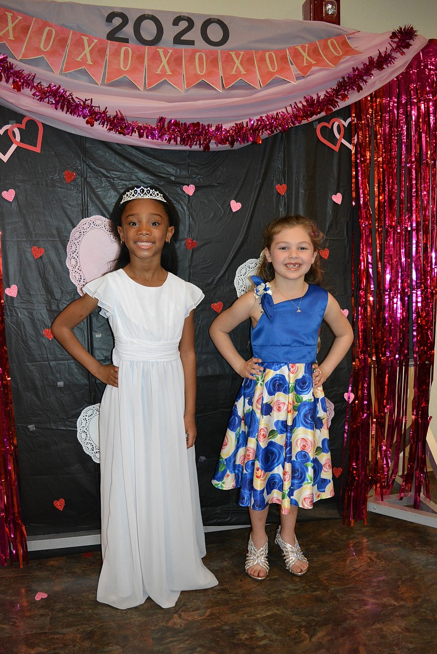 Kindergarten students Ahmani Mitchell and Bailey Merriman make sure to get  a photo together.