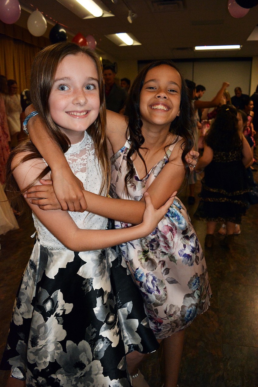 Fifth graders Lily Geisler and Mileidy hit the dance floor early.