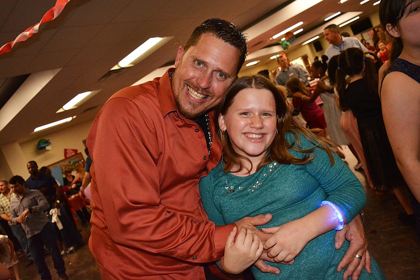 Tommy Huffstutler dance with his 9-year-old, Allyson.