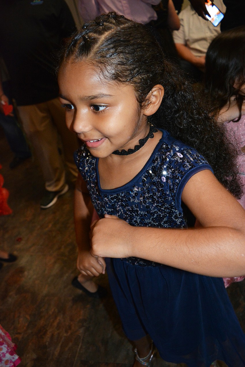 Pre-kindergartner Akilii Blenman dances to 