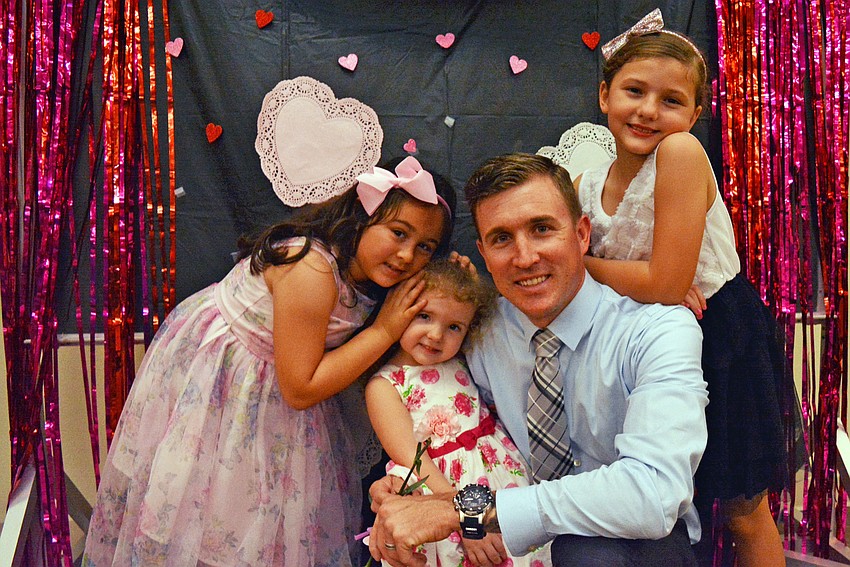Mea Donahue, Gabby Greer and Mayleigh Greer (right) make sure to take a group photo with their uncle, Josh Halloran.