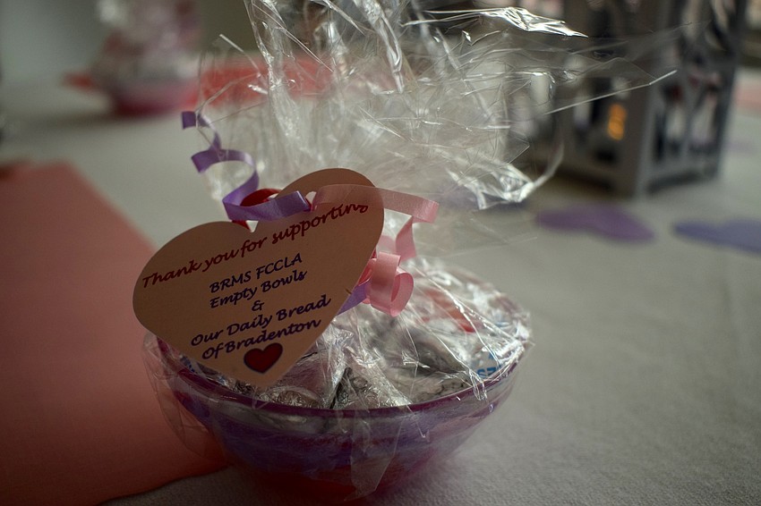 Braden River Middle's Family Career and Community Leaders of America hands out bowls of kisses to celebrate Valentine's Day and to remind people of those who are hungry and homeless.