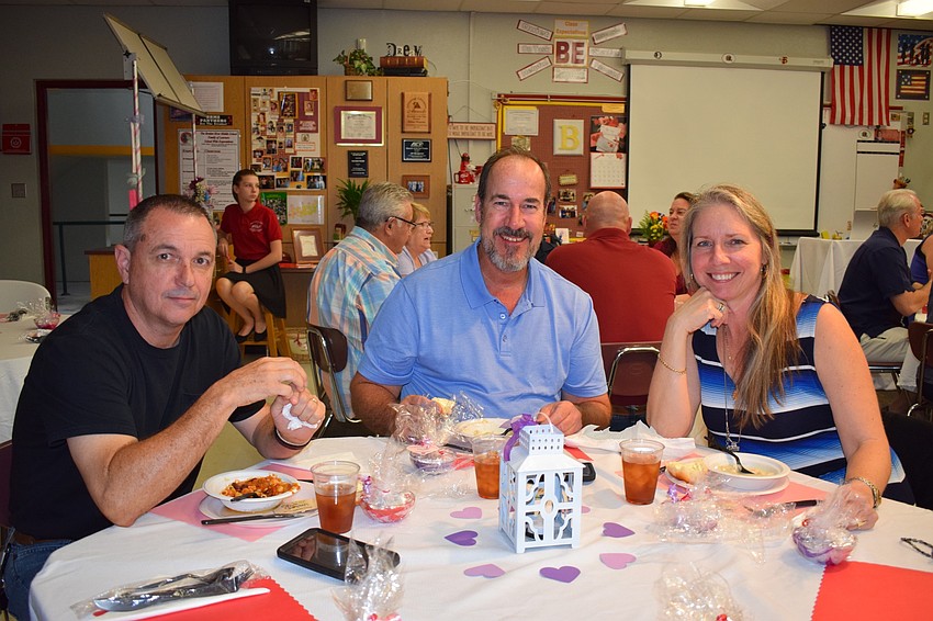Gary Bergeron, Tom Brassard and Nicole Gulsby enjoy bowls of soup. 