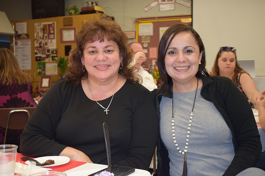 Ivelisse Rivera and Cecilia Contreras with Gleaner Life Insurance Society enjoy their soup. Gleaner Life Insurance Society was one of the sponsors of the event.