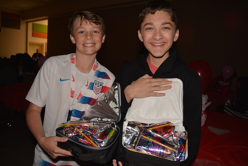 Seventh graders Joseph Knight and Denver Brown stock up on drinks.