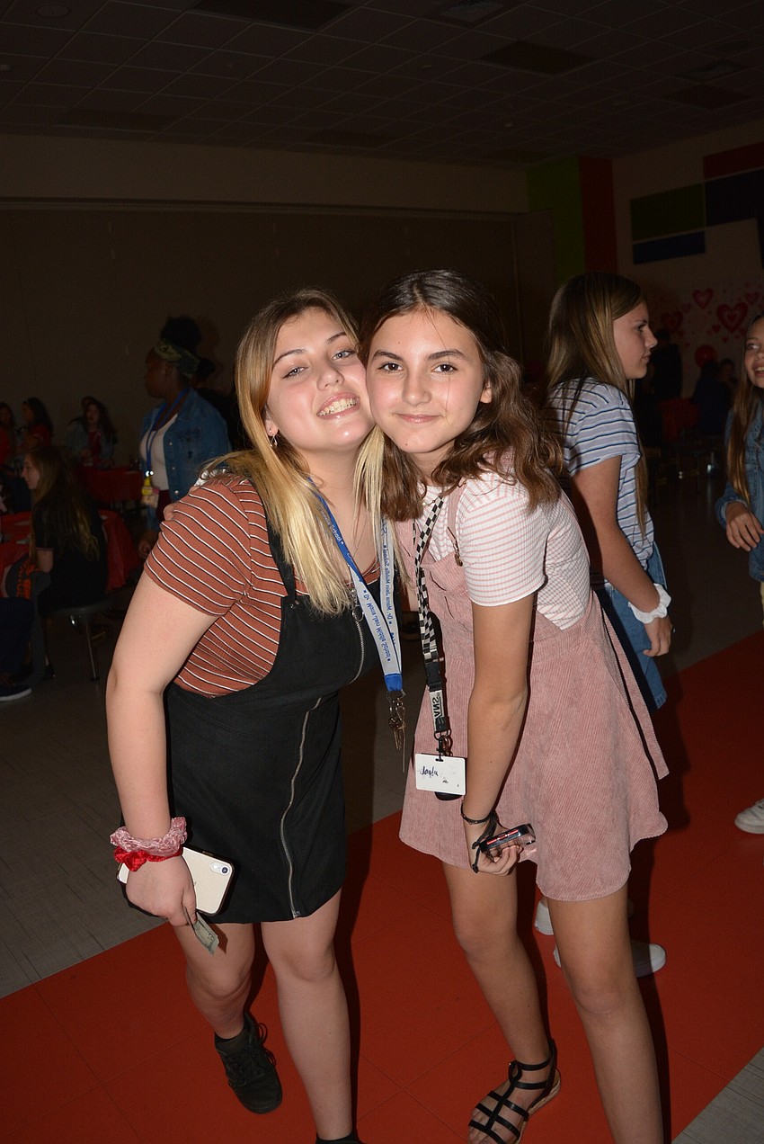 Sixth graders Jacyee Heller and Jayda Reid head to the dance floor for the song  