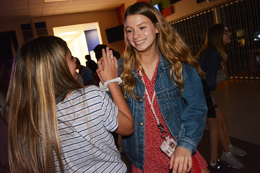 Sixth graders Natalie Fellows and Aleah Killan dance to 