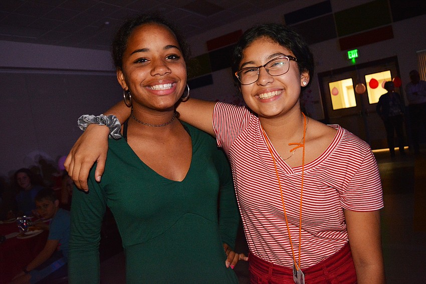 Sixth graders Camlin Woodwreth and Kayla Moreira are all smiles as they head back to dance floor after a quick break.