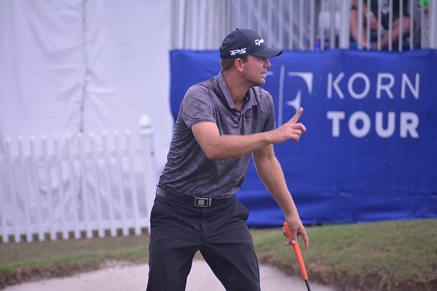 Taylor Montgomery gestures to the crowd after sinking a putt to birdie hole No. 18.
