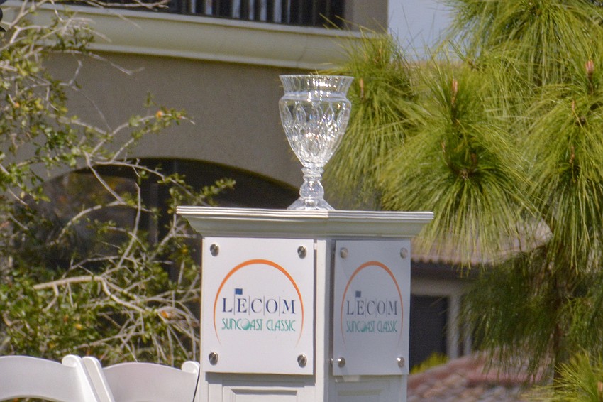 The LECOM Suncoast Classic trophy made an appearance at Lakewood National's first hole on day three.