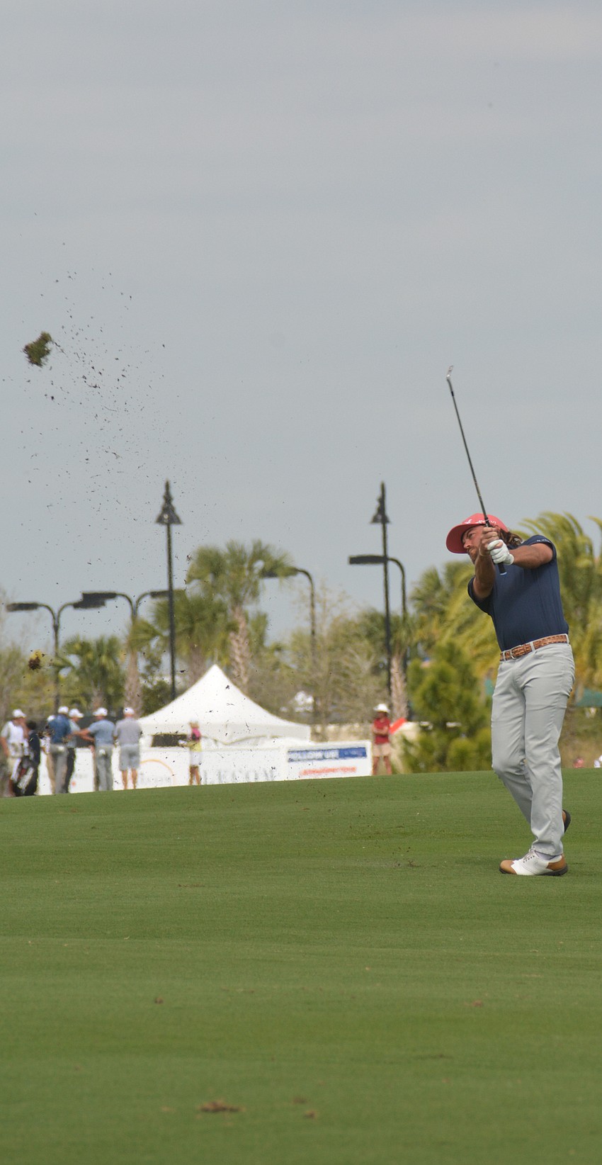 T.J. Vogel smashes a shot onto the green on No. 1 at Lakewood National.