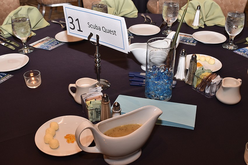 Tables were decorated with understated marine-themed trinkets.